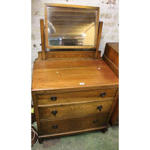 655 - Oak three drawer dressing chest.