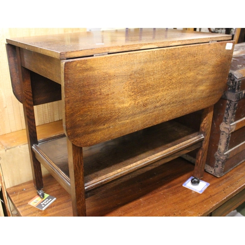 674 - Oak drop leaf trolley.