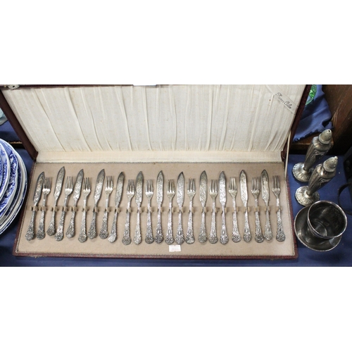 70 - Cased set of twelve silver plated knives and forks, silver plated candlesticks etc.