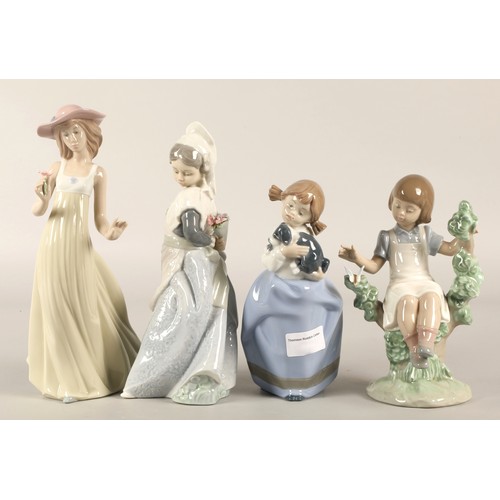 23 - Four Nao figurines (4)