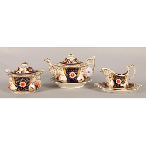 19 - Imari pattern tea set with hand-painted flower decoration, to include teapot, teacups sugar bowl etc