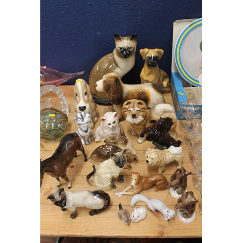 125 - Pottery animals to include a Beswick horse, etc.