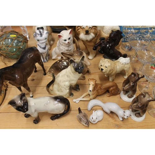 125 - Pottery animals to include a Beswick horse, etc.