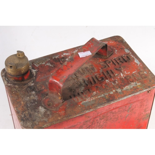 134 - Red painted metal fuel can, and a small oil can.