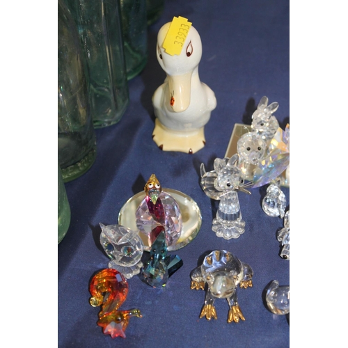 135 - Beswick model of a duck with ladybird, and glass animal models.