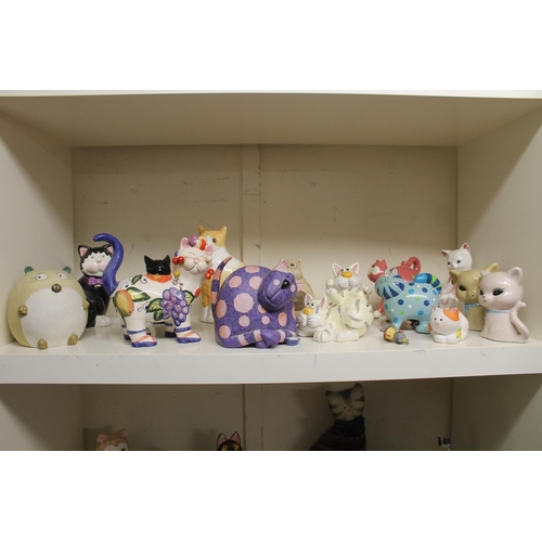 323 - Shelf containing novelty cat models.