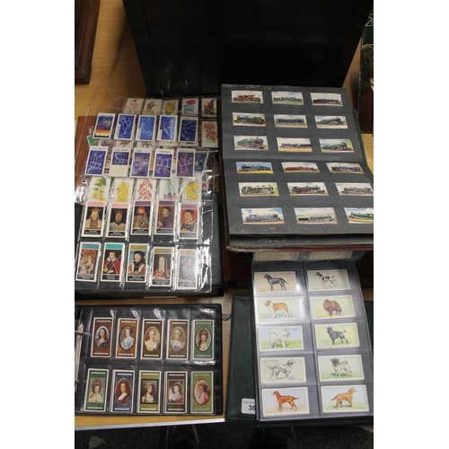 362 - Six leather folders containing cigarette cards to include trains, kings and queens, cars, animals, e... 