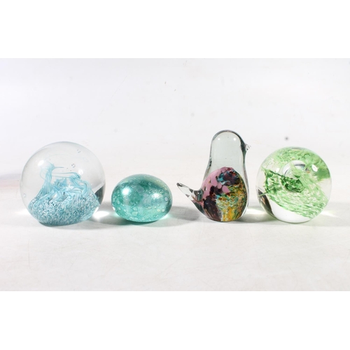 77 - Studio Art Glass vase of goblet form, a glass squirrel nut dish, three glass paperweights, and a Mdi... 