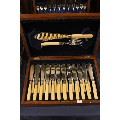 94 - Two canteens of silver-plated cutlery.