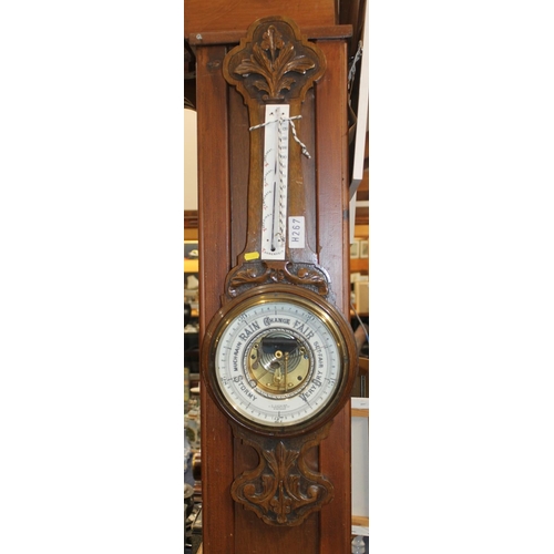 58 - Carved oak barometer.