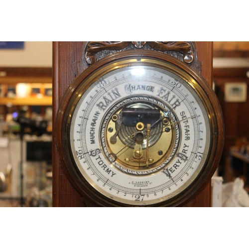 58 - Carved oak barometer.