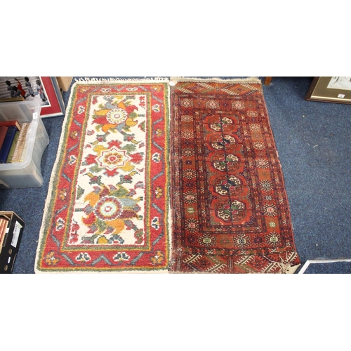 696 - Eastern red ground fringed rug and a cream ground rug, 120 x 57cm.