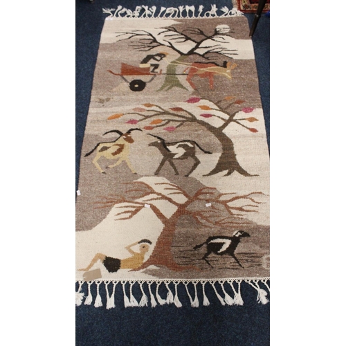 700 - African rug decorated with figures, animals and trees, 140cm x 81cm.