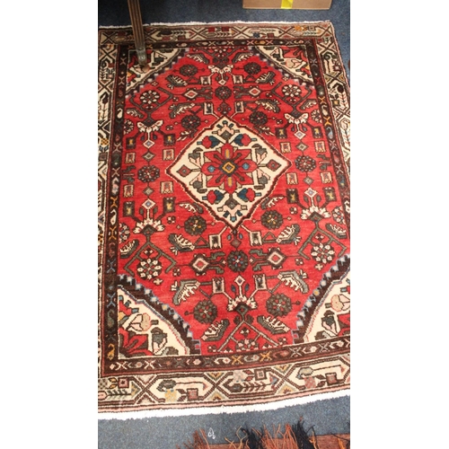 704 - Eastern red ground multi border fringe rug, 146cm x 102cm