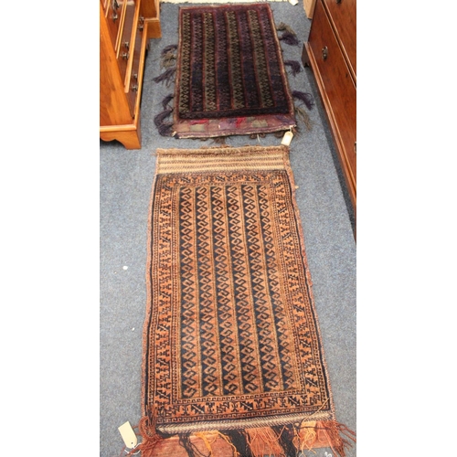 705 - Two Eastern saddle bags with geometric decoration, 110cm x 56cm.