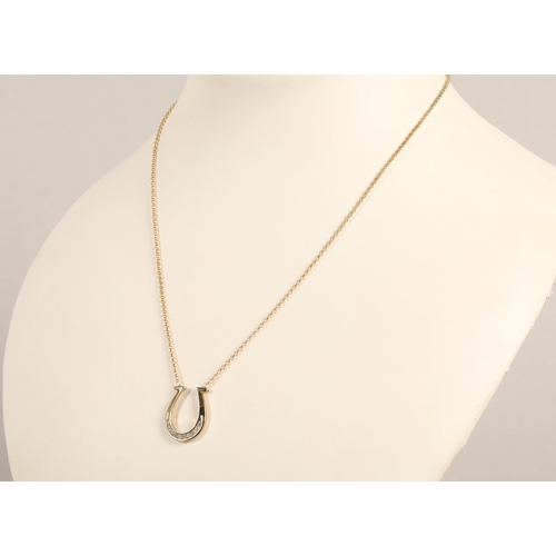 67 - 9ct gold horseshoe necklace set with diamonds, 3.7g