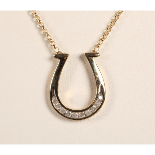 67 - 9ct gold horseshoe necklace set with diamonds, 3.7g