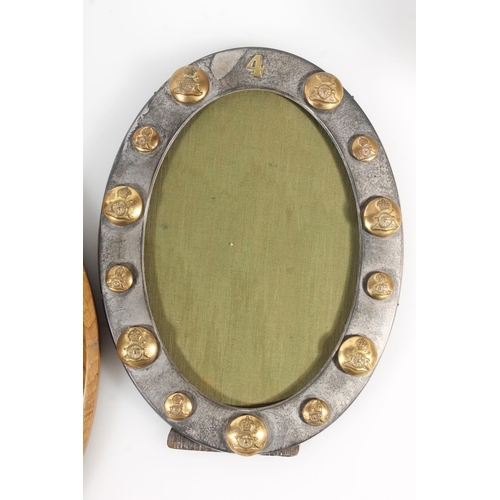 396C - Oval silver clad easel backed tabletop photograph frame decorated with Royal Artillery buttons, 25cm... 