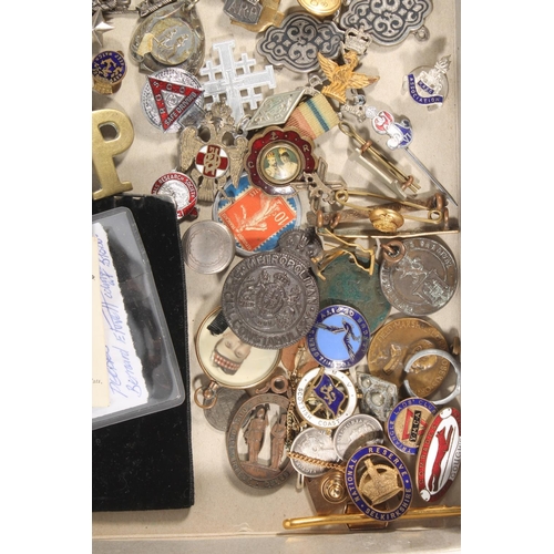 396E - Tray of badges and curios to include a rolled gold framed miniature portrait of a British officer, s... 