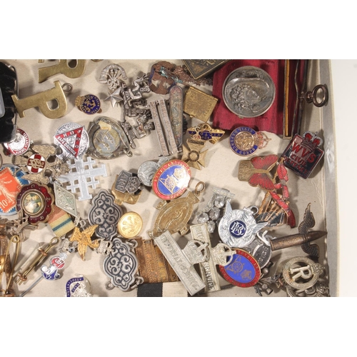 396E - Tray of badges and curios to include a rolled gold framed miniature portrait of a British officer, s... 