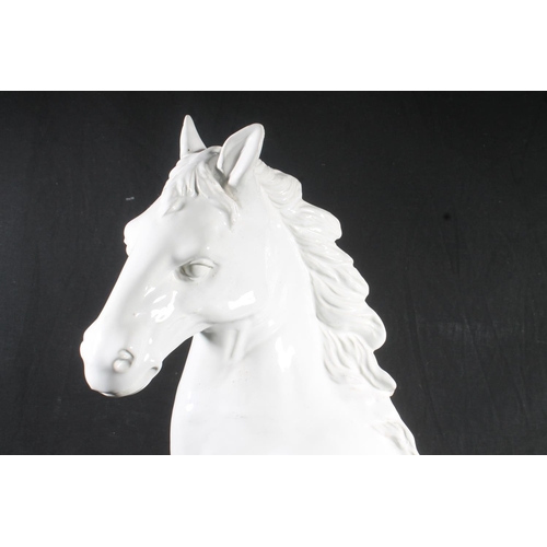 62 - White glazed ceramic model of horse, 59cm high.