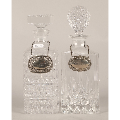 270 - Collection of four cut glass decanters, one with a wooden stand. (4)