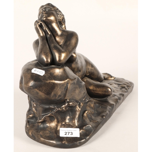 273 - Bronze statue of a lying lady leaning on a rock. 44cm long.