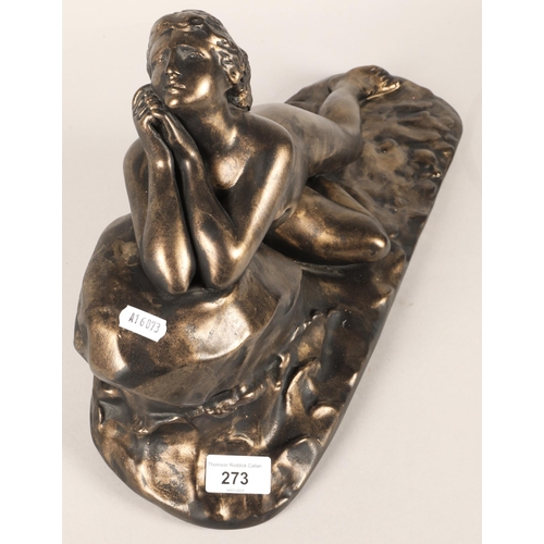 273 - Bronze statue of a lying lady leaning on a rock. 44cm long.