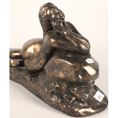 273 - Bronze statue of a lying lady leaning on a rock. 44cm long.