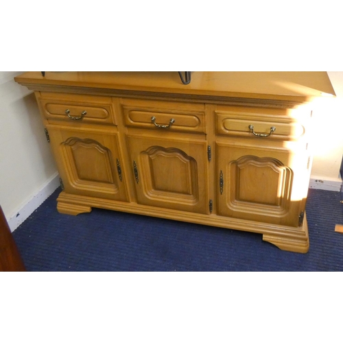 283 - Modern oak three door over three drawer sideboard.