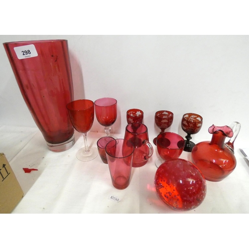 298 - Collection of various Cranberry glass paperweights, vase etc.