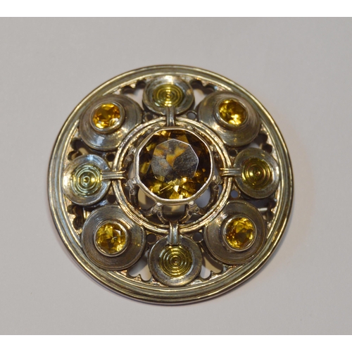 174 - Robert Crerar (Scottish) Silver circular brooch of Celtic shield form with gold and cairngorms, 47mm... 