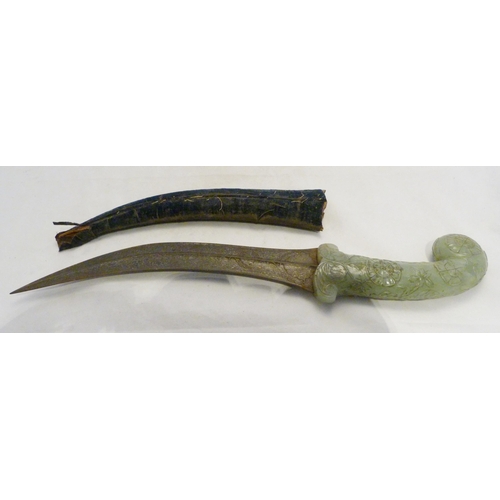 Mughal dagger with carved scroll jade handle and curved damascened ...