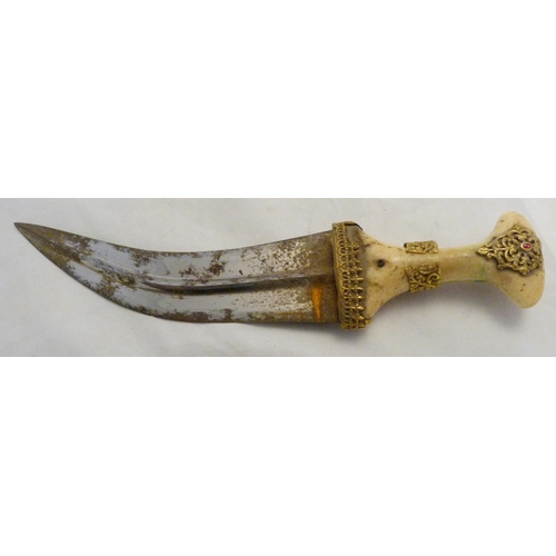 329 - Arabic Jambiya dagger, with bone hilt bearing yellow metal appliques and ruby-coloured jewelled ston... 