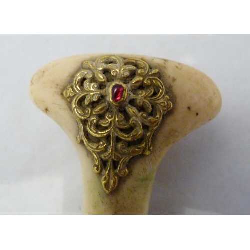 329 - Arabic Jambiya dagger, with bone hilt bearing yellow metal appliques and ruby-coloured jewelled ston... 