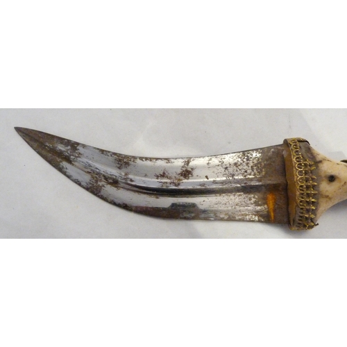 329 - Arabic Jambiya dagger, with bone hilt bearing yellow metal appliques and ruby-coloured jewelled ston... 