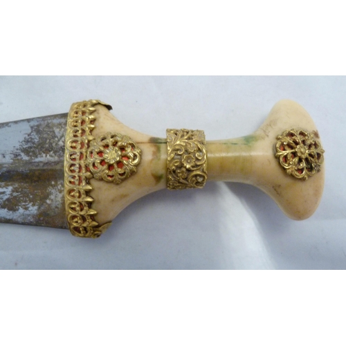 329 - Arabic Jambiya dagger, with bone hilt bearing yellow metal appliques and ruby-coloured jewelled ston... 