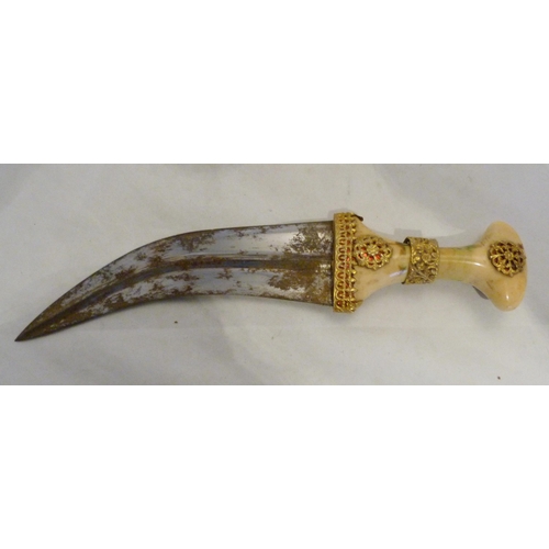 329 - Arabic Jambiya dagger, with bone hilt bearing yellow metal appliques and ruby-coloured jewelled ston... 