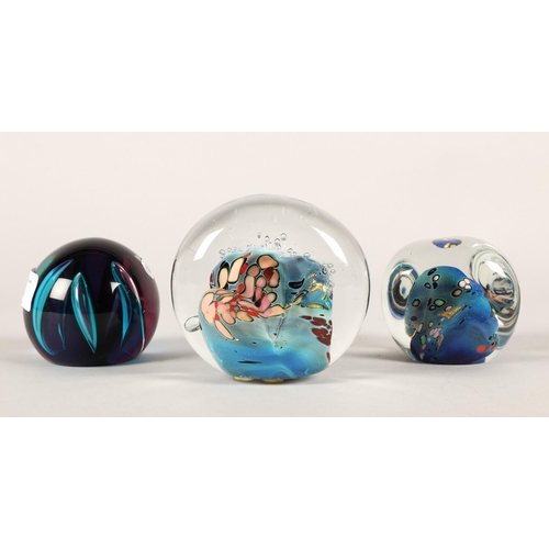 24 - Three glass paperweights to include Caithness 'Scimitar' and two Rollin Karg (3)