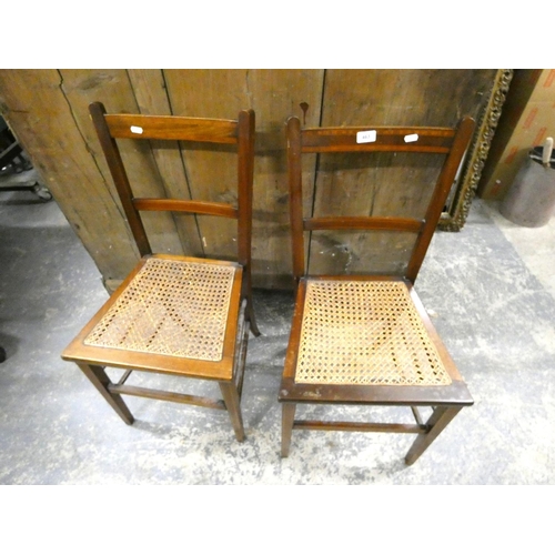 490 - Two mahogany cane seated chairs.