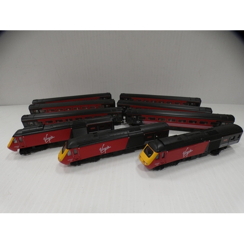 10 - Three Hornby OO gauge Virgin 'Lady in Red' model locos and six carriages.