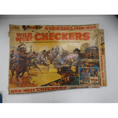 11 - Wild West checkers game and a Railroader game, both boxed.