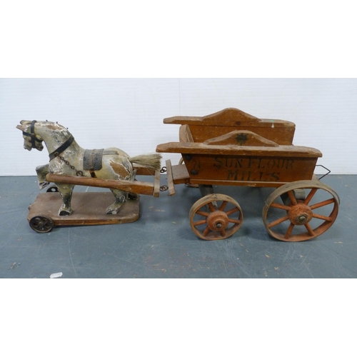 126 - Pull-along horse toy, wheelbarrow, cauldron, painted toy stable, accessories etc.