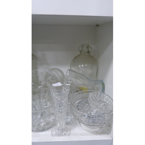 133 - Demi johns, cut glass bowls, vases etc (one shelf).