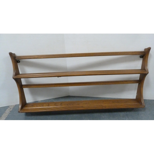 134 - Two Ercol plate racks.