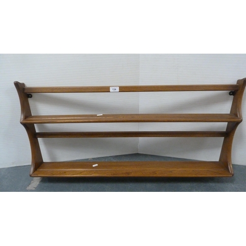 134 - Two Ercol plate racks.