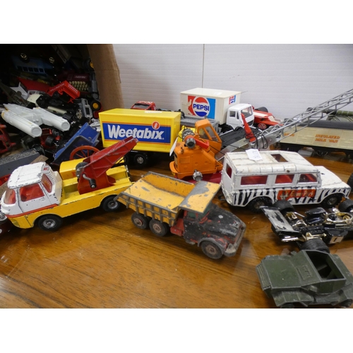 180 - Two cartons containing a large collection of playworn diecast models to include Dinky examples.