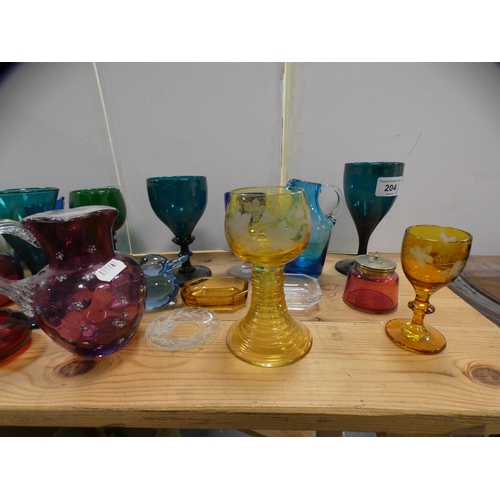 204 - Decorative glassware to include cranberry, green and turquoise wine glasses, green glass bowl, signe... 