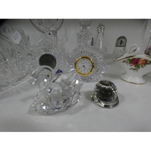 212 - Crystal and glassware to include a mantel clock, bowl, candlesticks, preserve jar and cover, candela... 