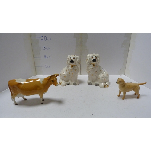 226 - Pair of Beswick small wally dogs, Beswick figure of a cow and a Beswick figure of a dog.  (4)